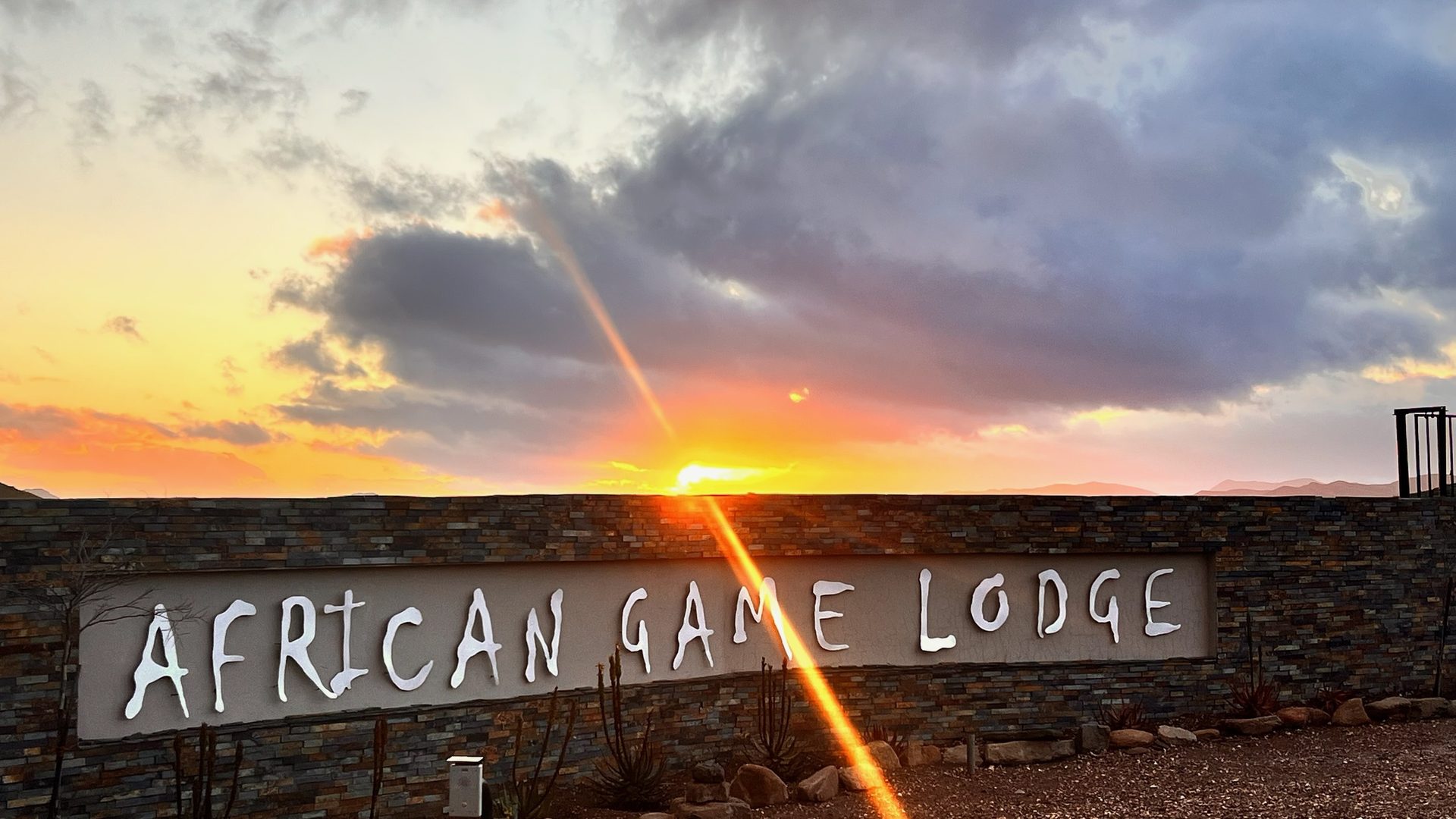 African Game Lodge entry gate at sunset